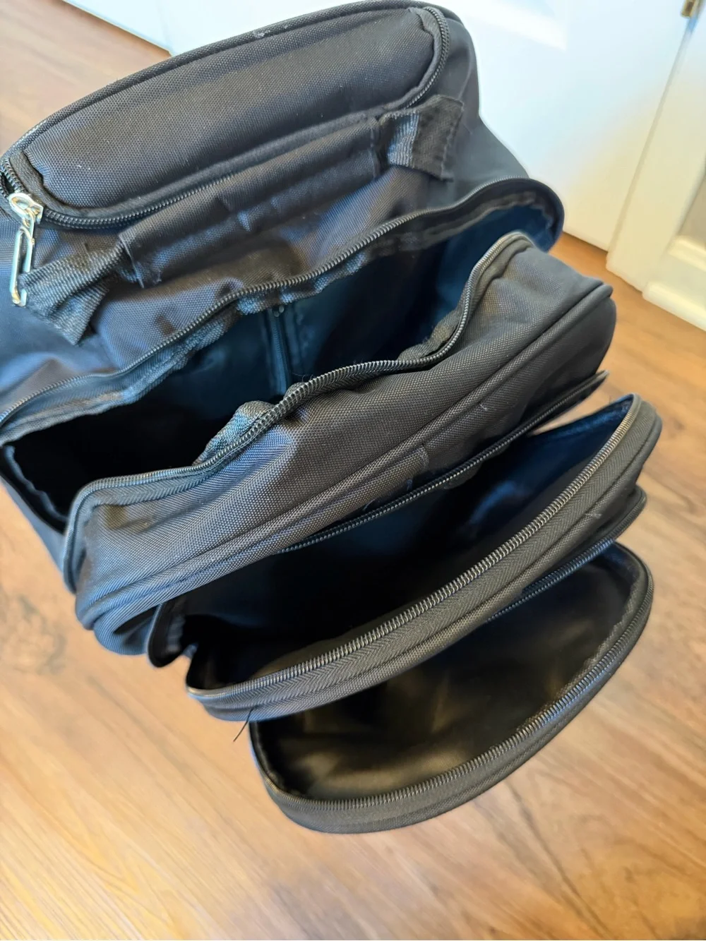 Black Everyday Rolling Travel Backpack with Multiple Pockets